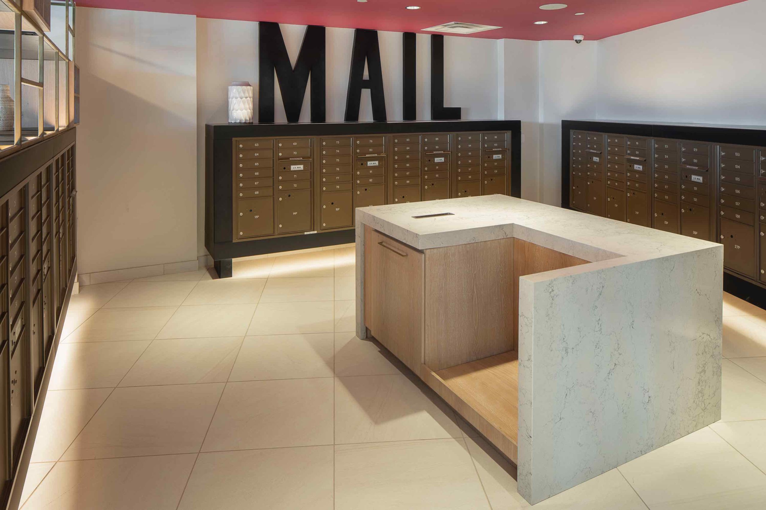 Interior of a mail room with counter. One of the amenities of 250 Mission in Baltimore, MD.